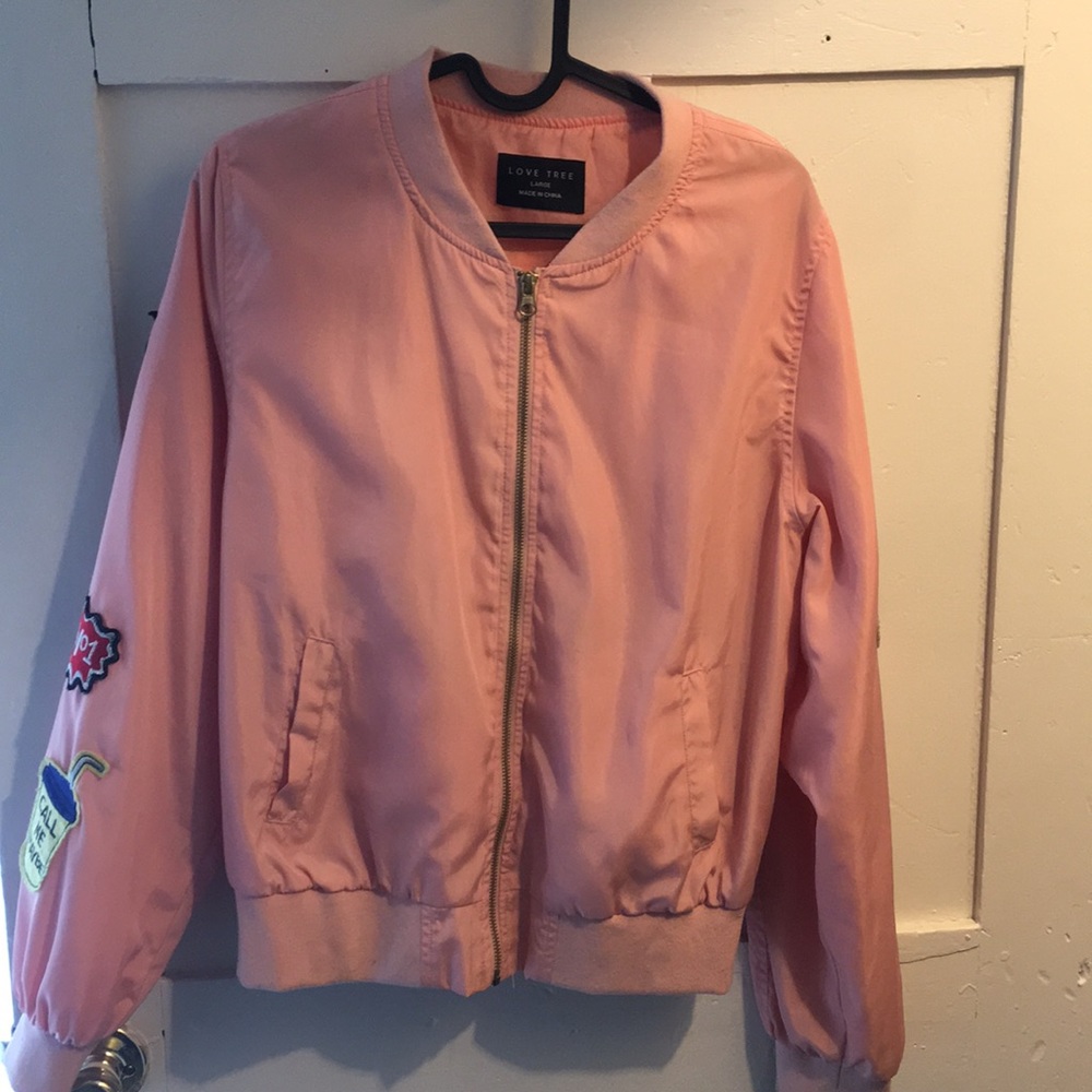 Pink wind breaker , medium in good shape .